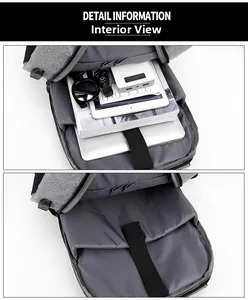 Internal compartments of a grey business laptop backpack showing multi-layer storage pockets