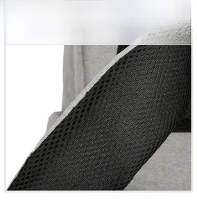 Detail of grey fabric shoulder strap with black honeycomb breathable mesh padding