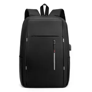 Waterproof black business laptop backpack with USB charging port and red triangle detail