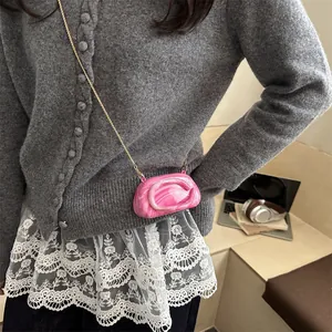 Pink marble acrylic shell cross body bag with golden chain and D-shaped metal logo