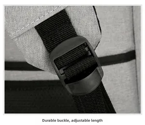 Detail of durable black plastic strap buckle on grey business commuter backpack