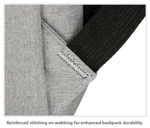 Detail of reinforced cross-stitching on grey fabric backpack for heavy-duty support