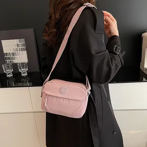 Pink high-capacity crossbody square bag with adjustable strap and casual sports style
