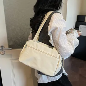 Minimalist beige large capacity commuter tote bag with multi-pockets and smooth nylon finish