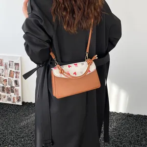 Fashionable crossbody bag with cherry bear print and knotted strap shown on model