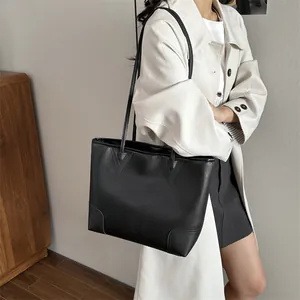 Classic black leather tote bag with lychee texture for chic daily commuting style