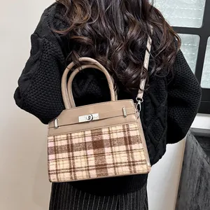 Fashionable large capacity pink tweed crossbody bag with brown leather handles