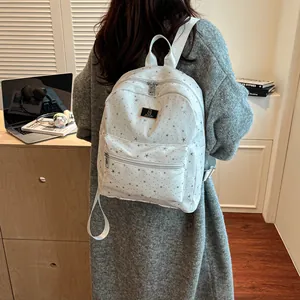 White casual backpack with star patterns and large capacity for women commuting