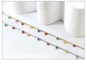 Detail of 18k gold and silver plated chains featuring colorful zircon stone charms