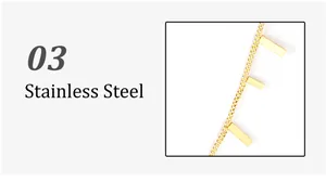 Detail shot of golden stainless steel rectangular pendants on a fine link chain necklace