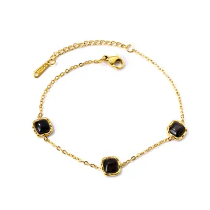 Golden stainless steel chain bracelet featuring three square black stones with extender