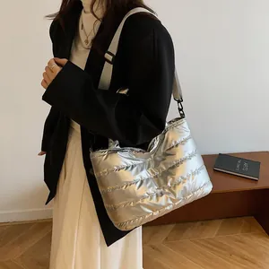 Chic silver metallic quilted puffer tote bag for women with adjustable shoulder strap