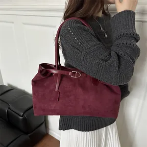 Large burgundy suede tote bag for women shown as a stylish retro shoulder bag