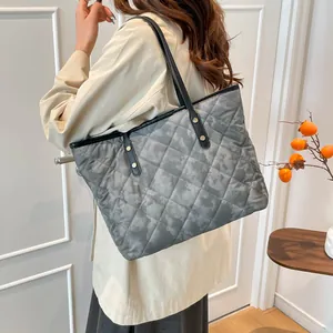 Chic quilted grey tote bag with camouflage pattern and spacious shoulder strap design