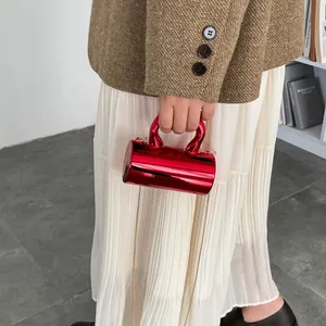 Mini red metallic cylindrical chain bag with top handle and gold strap for 2026 fashion
