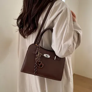 Brown lychee texture large capacity crossbody bag with metal lock and decorative charm