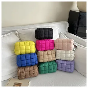 Multiple colors of quilted padded clutch bags and pouches in a stylish collection