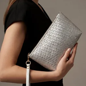 Silver woven faux leather clutch bag with top zipper and wristlet strap for women