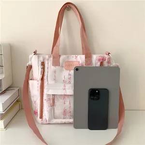 Detail of canvas tote bag with Chinese calligraphy showing large capacity for tablets