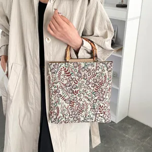 Floral canvas tote bag with bamboo handles and vintage purple tapestry pattern