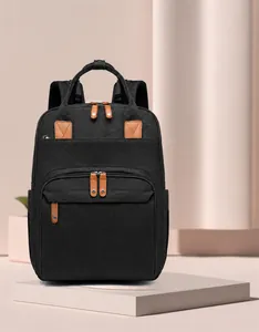 Detail view of the black mummy bag showing the premium leather trim and durable fabric texture