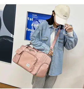 Bolsa de viaje rosa de gran capacidad con separación seco-húmedo y correa ajustable