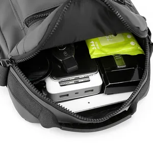 Internal view of waterproof shoulder bag showing large capacity and multi-pocket storage