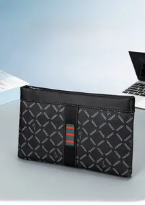 Close-up of black business envelope bag with red and green stripes and metal zipper