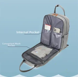 Macro view of gray diaper bag interior with functional pockets and mesh compartment
