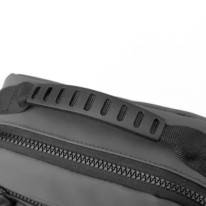 Detailed view of the dark grey oxford fabric bag with durable handle and resin zipper