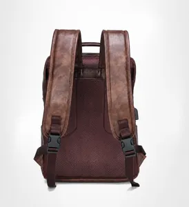 Detail of dark brown leather backpack with breathable mesh padding and built-in USB charging port
