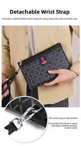Detail of detachable wrist strap and metallic hook on the plaid business clutch bag