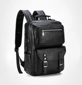 Detail of black leather business backpack with USB charging port and textured finish