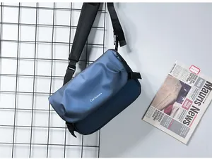 Detail of blue messenger bag with adjustable strap and breathable mesh padding