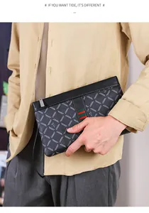 Detailed close-up of men's black leather clutch with signature red and green webbing strap