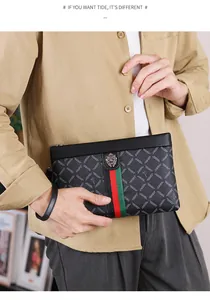 Detail of men's black leather clutch featuring diamond texture and iconic lion head logo