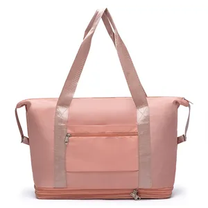 Pink waterproof travel duffel bag with expandable bottom layer and front zipper pocket