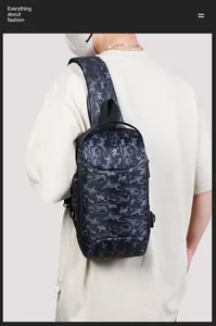 Detail view of anti-theft combination lock on camouflage cross-body bag for men