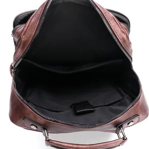 Brown leather backpack for men featuring large capacity and 15.6 inch laptop compartment