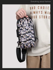 Detail of camouflage chest bag featuring anti-theft combination lock and wide nylon strap