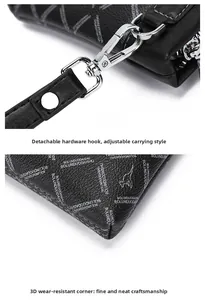 Detail of detachable metal hook and stitched corners on men's printed leather clutch bag
