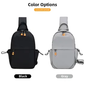 Front view of black and grey tactical chest bags with vibrant orange zipper pulls