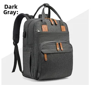 Detailed view of dark grey multifunctional diaper bag with USB port and multiple pockets
