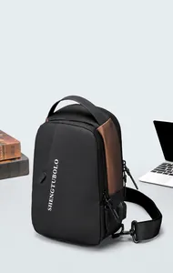 Detail of multi-functional chest bag with USB port and geometric textured fabric