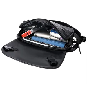 Large capacity black messenger bag showing spacious main compartment with tablet and items
