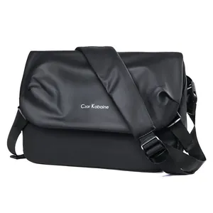 Minimalist matte black messenger bag with adjustable strap and large capacity
