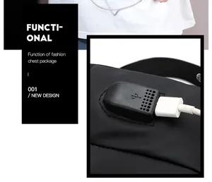 Detail view of the functional chest bag featuring a built-in USB charging port and cable