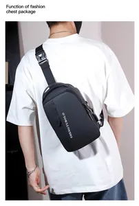 Detail view of the black waterproof nylon chest bag featuring a white brand logo on back