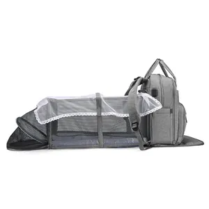Large capacity gray diaper backpack with foldable travel bassinet and mosquito net