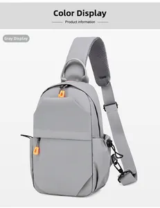Macro shot of grey crossbody bag with orange zippers and breathable mesh strap